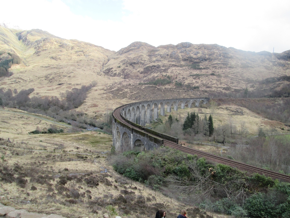 Scenic view of a viaduct in a hilly landscape.
