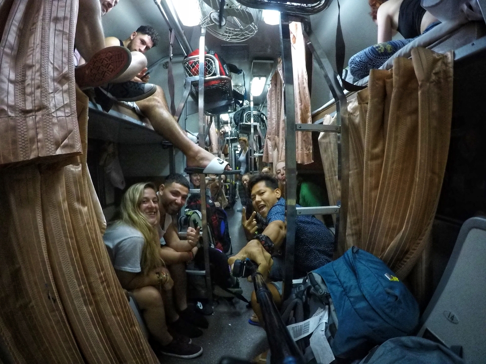 Group of people in a sleeper train enjoying their journey.