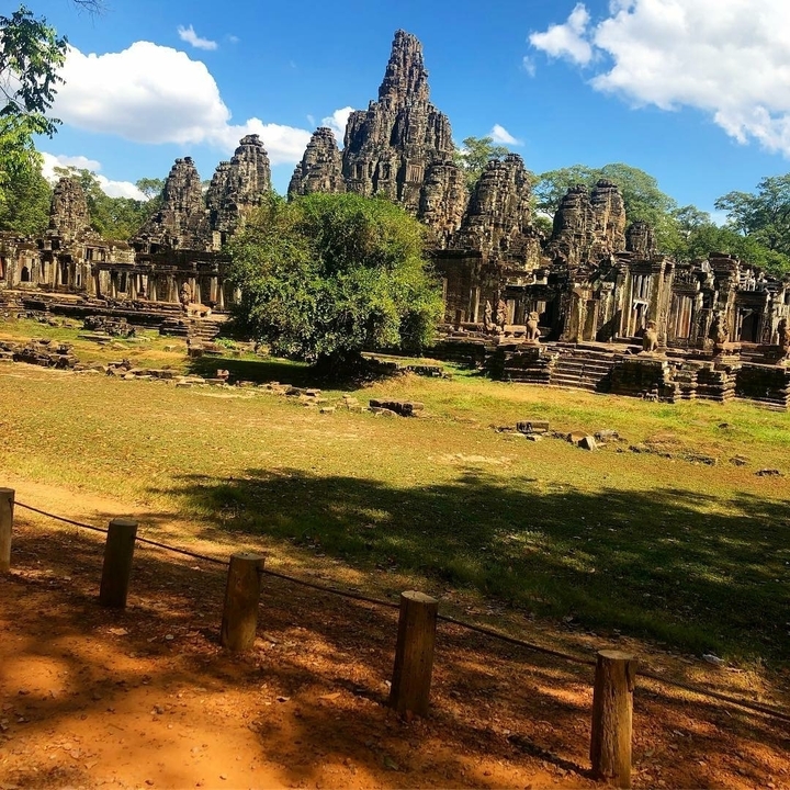 Ancient temple ruins surrounded by greenery.