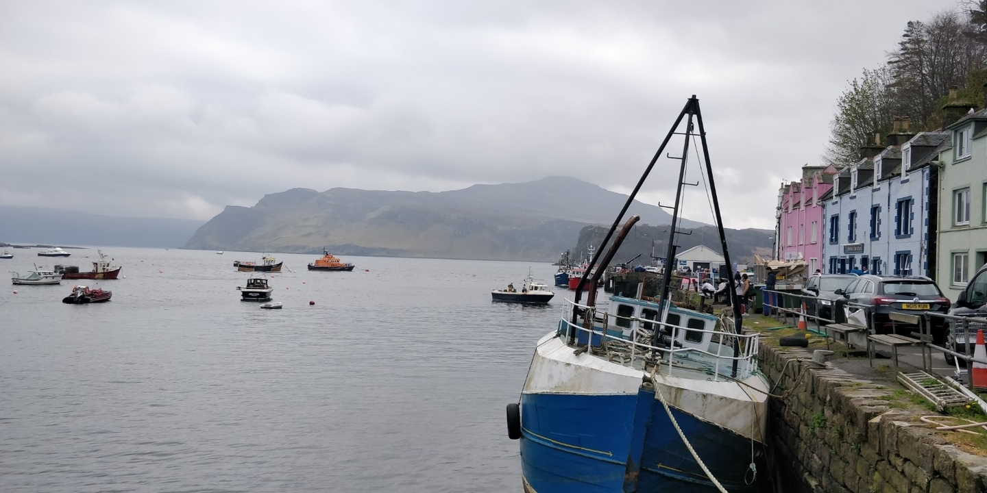 Colorful buildings and boats along a waterfront.