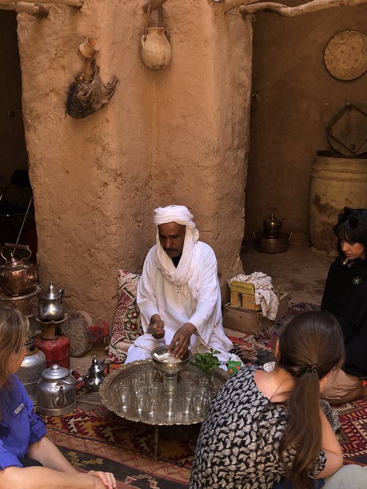 Man in traditional attire performing a ritual or ceremony.
