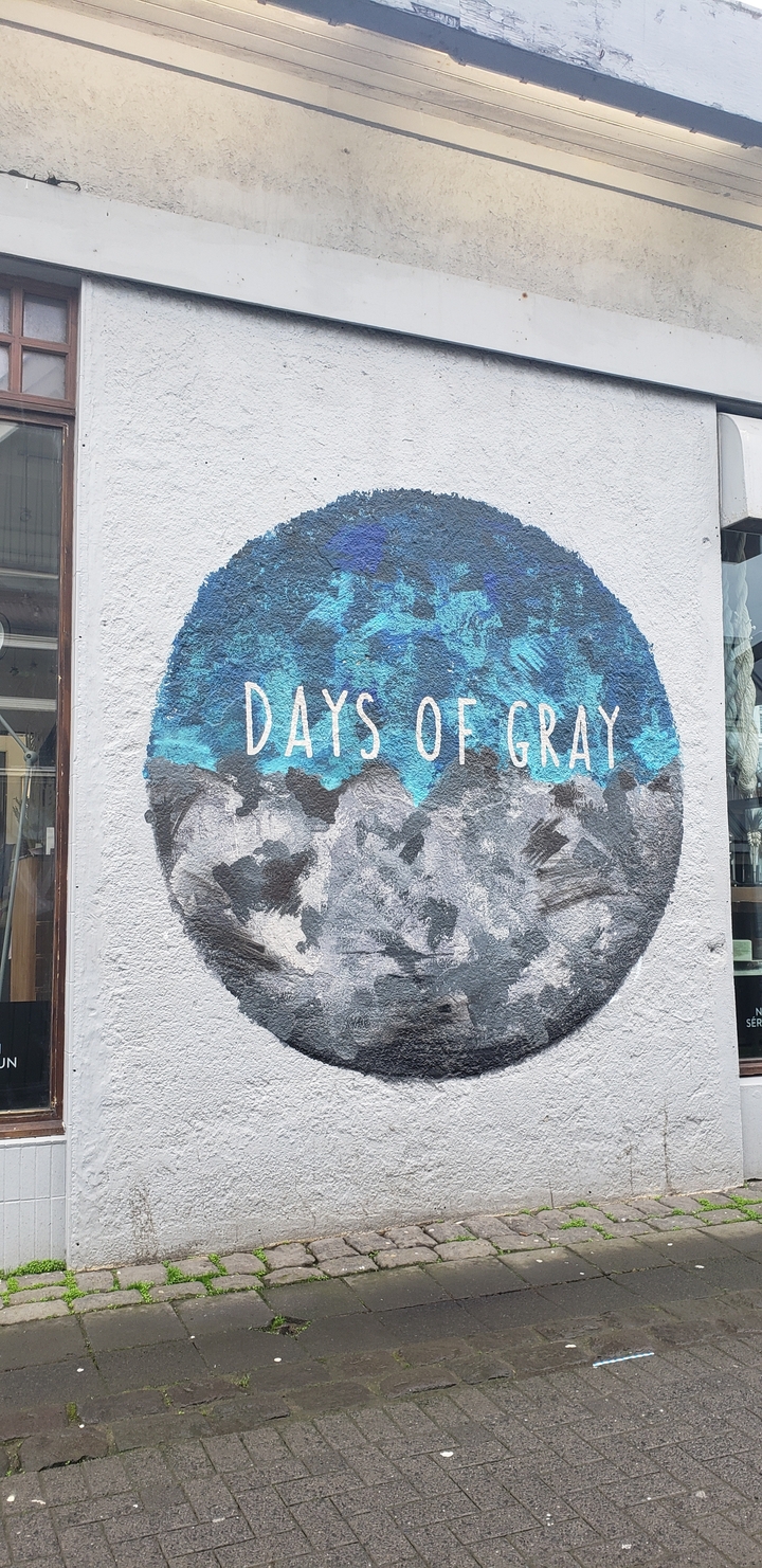 Street art mural with text 'Days of Gray'.
