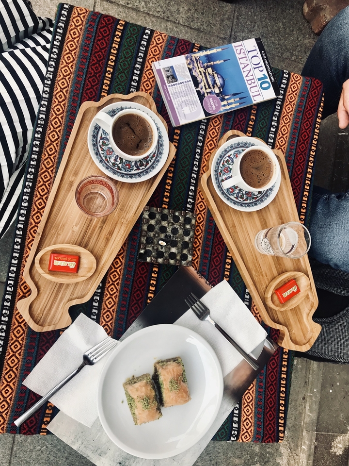 Traditional Turkish coffee with a vibrant table setting.