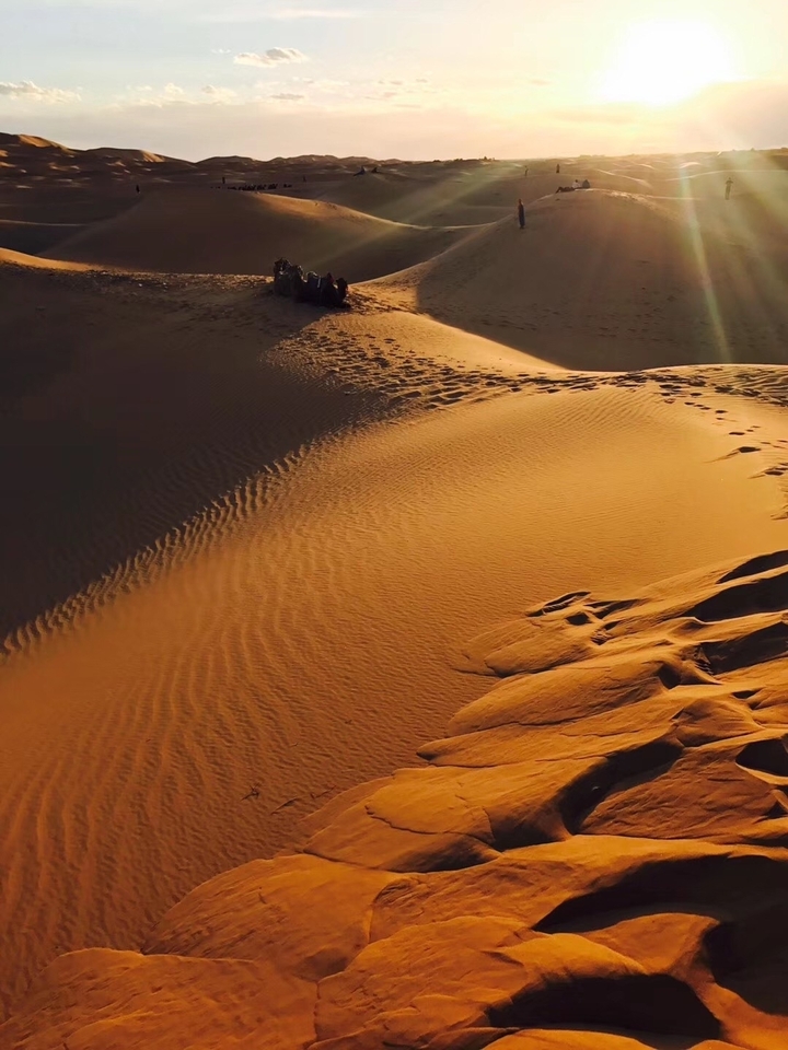 Golden sand dunes with textured patterns