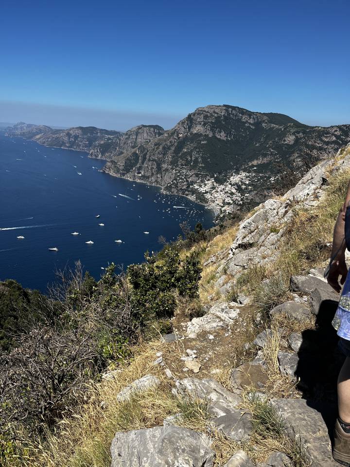 Rocky coastline with boats on the sea near Positano.