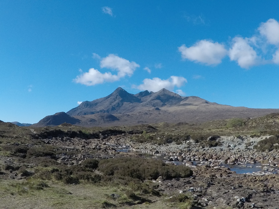 Mountainous landscape with clear blue sky.