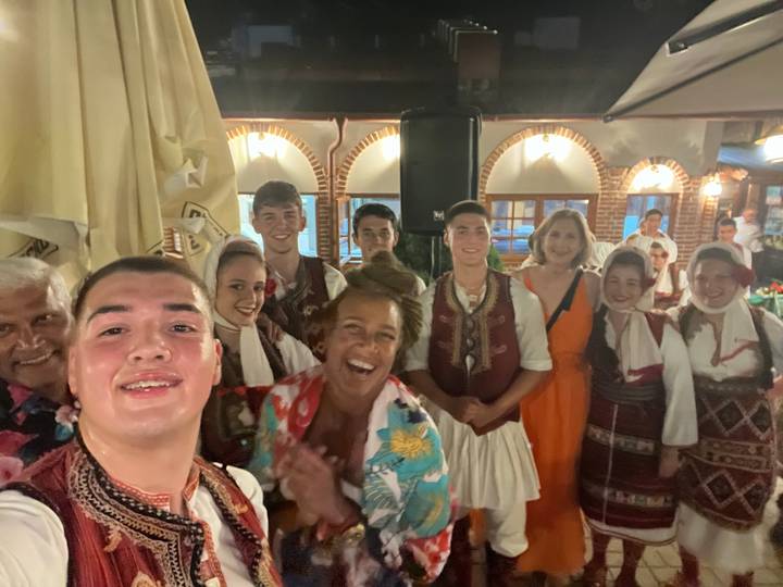 Group of people in traditional garments at event