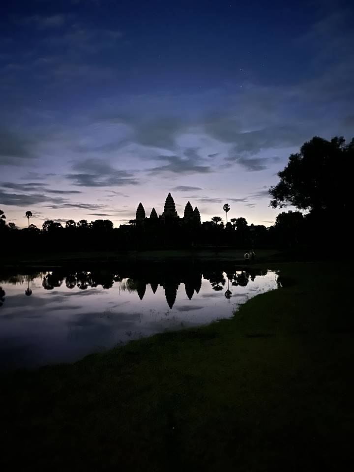 Reflection of Angkor Wat temple at dusk.