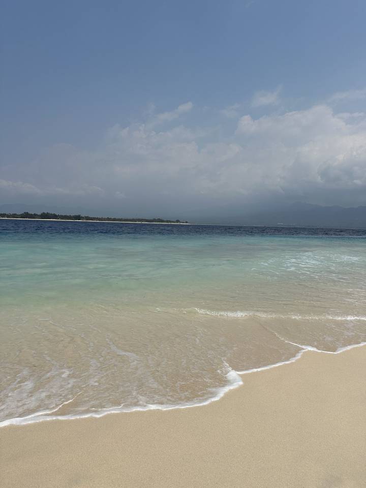 A calm beach with gentle waves.