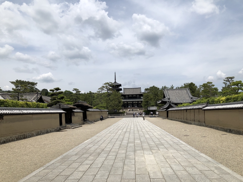 Pathway leading to a traditional Japanese building.