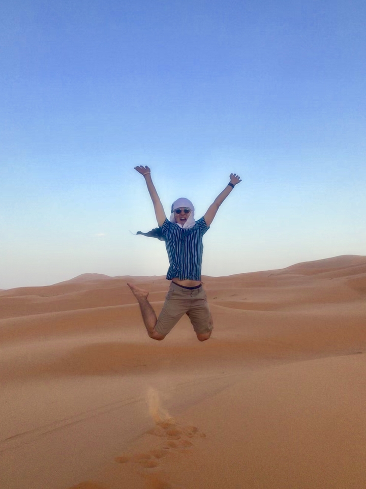 Person jumping with joy in the desert