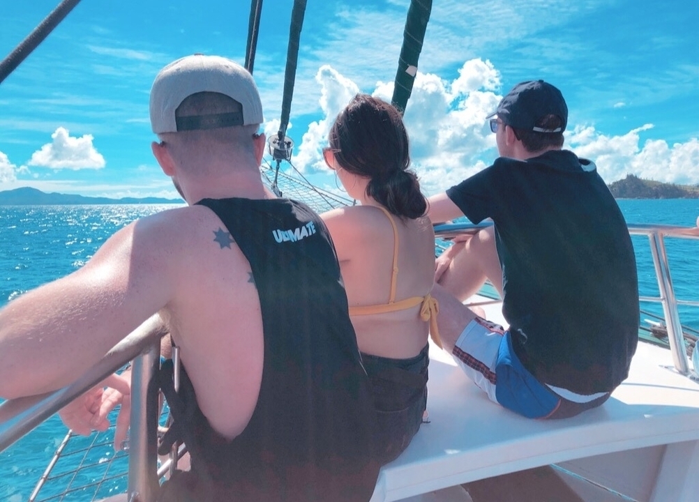 People on a boat enjoying a scenic view.
