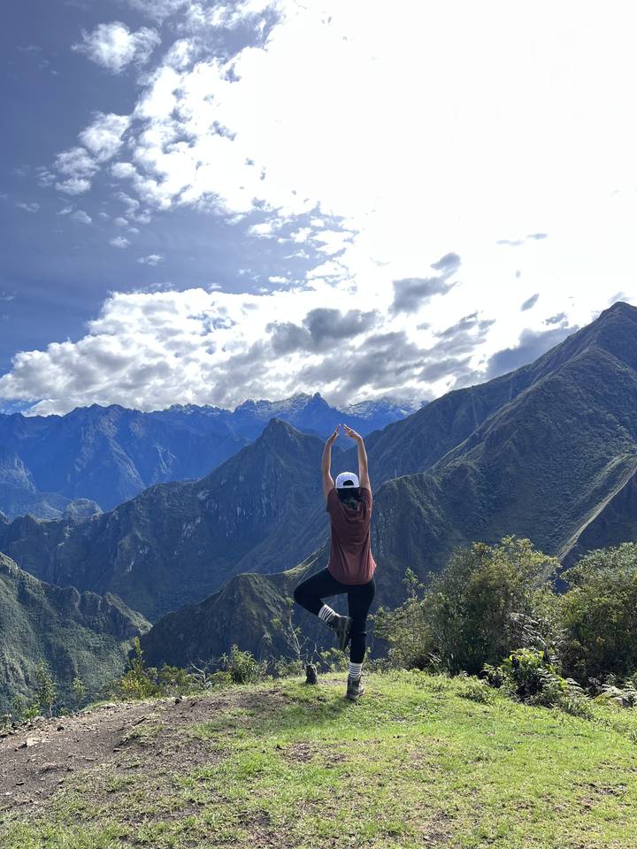 Person experiencing tranquility with mountains.