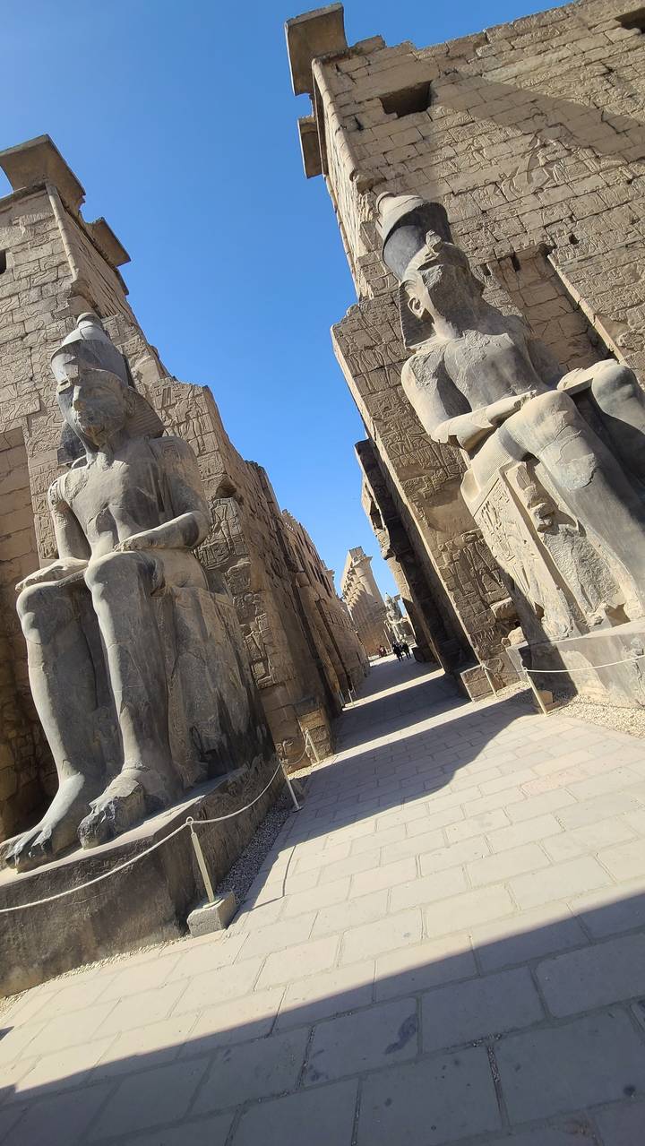 Ancient Egyptian statues at a temple temple.