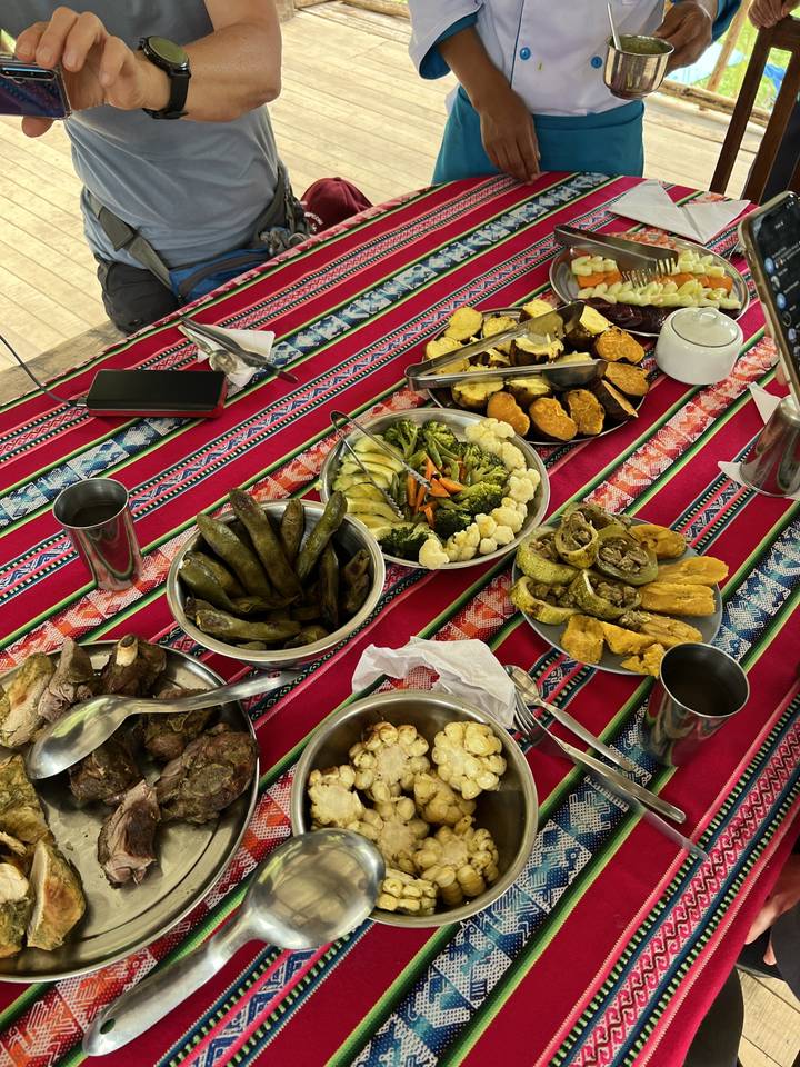 Traditional Peruvian food spread on a colorful table.