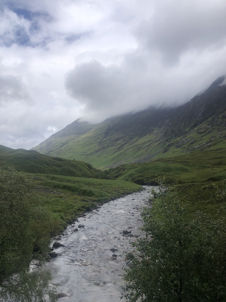 River flowing through a lush green valley.