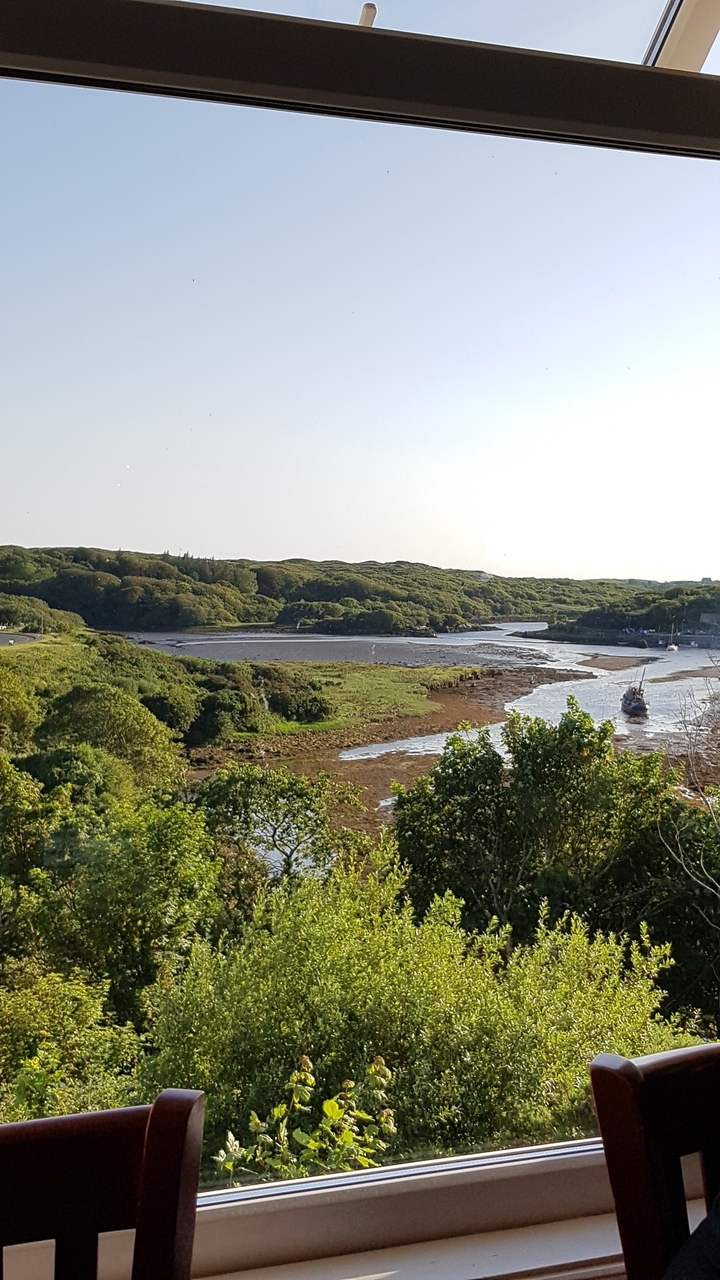 Scenic river bend with lush greenery.