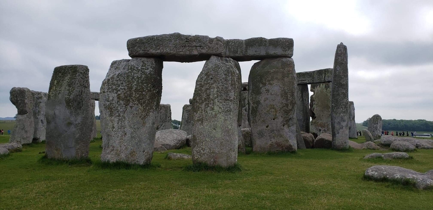 Stonehenge with stones and some visitors in the background
