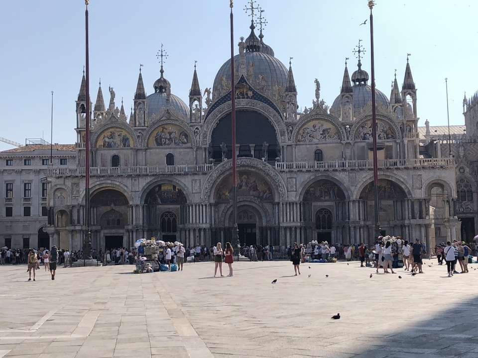 St. Mark's Basilica with many people in the square.