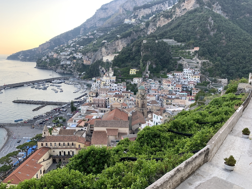 Aerial view of a coastal town with colorful houses.
