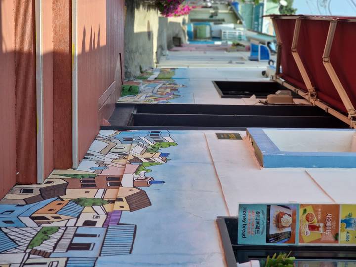 Upside-down mural on a building.