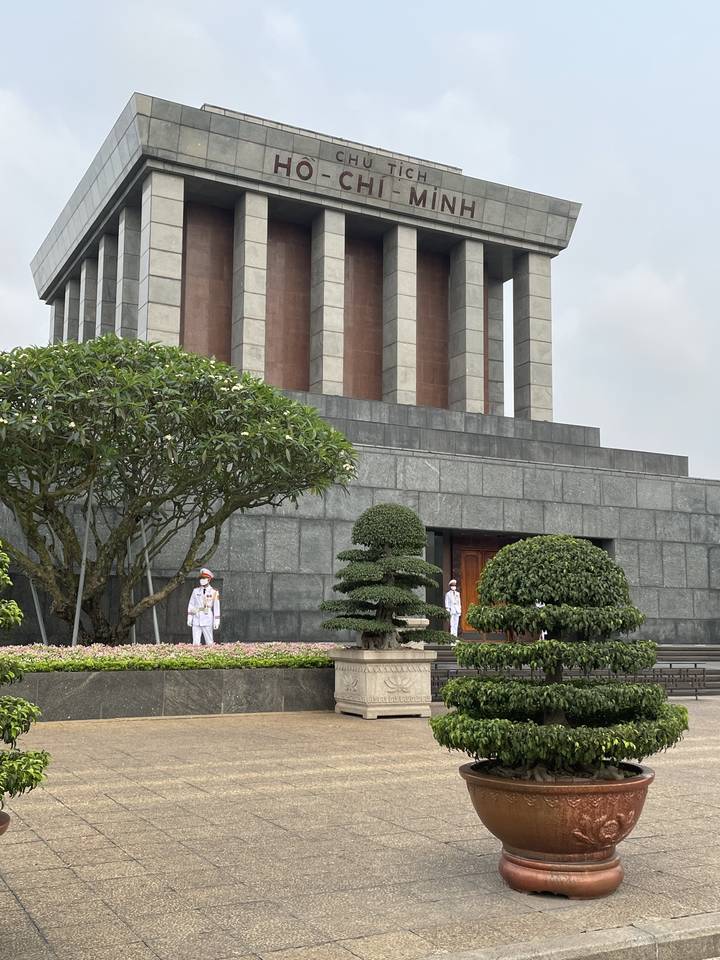 Ho Chi Minh Mausoleum with guards in uniform.
