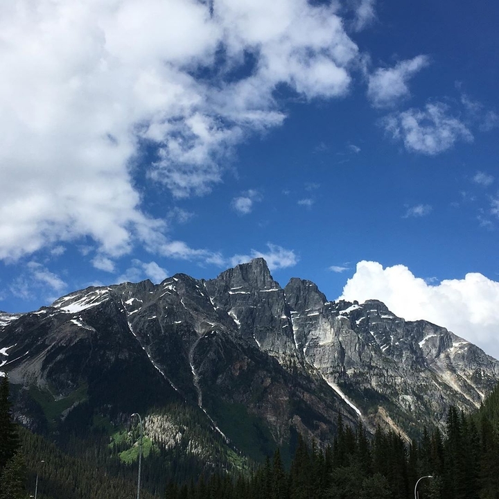 Rocky mountain range under a clear blue sky.