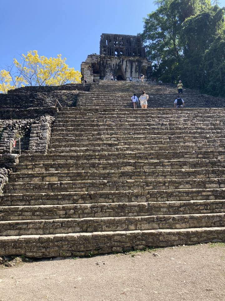 Tourists exploring ancient stone steps.