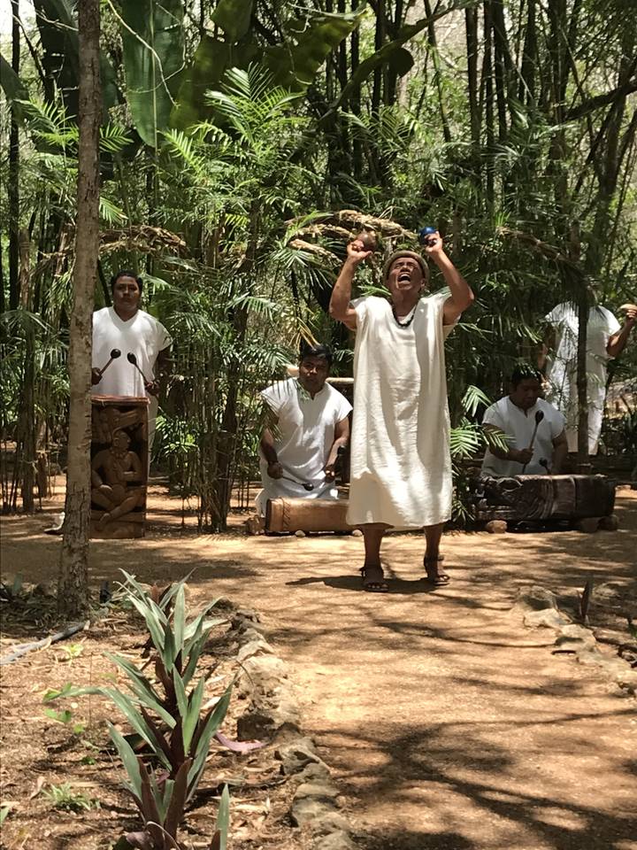 People performing outdoor ritual.
