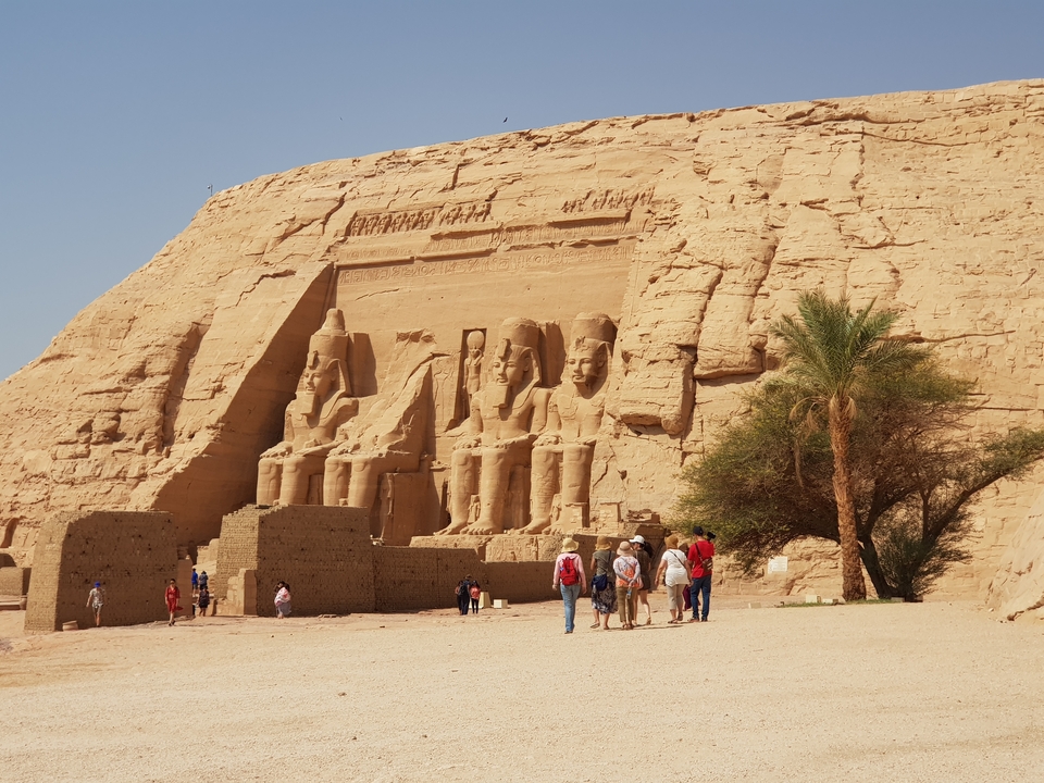 Tourists standing in front of the Abu Simbel temples.