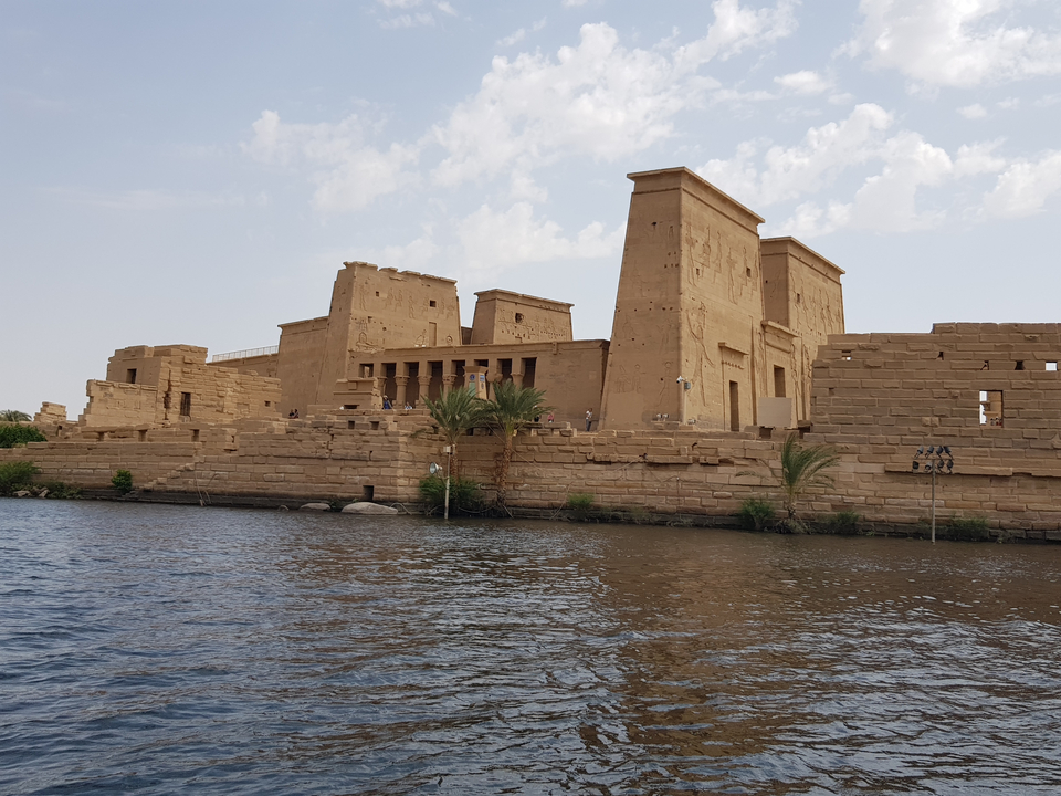 Ancient Egyptian temple on the banks of a river.