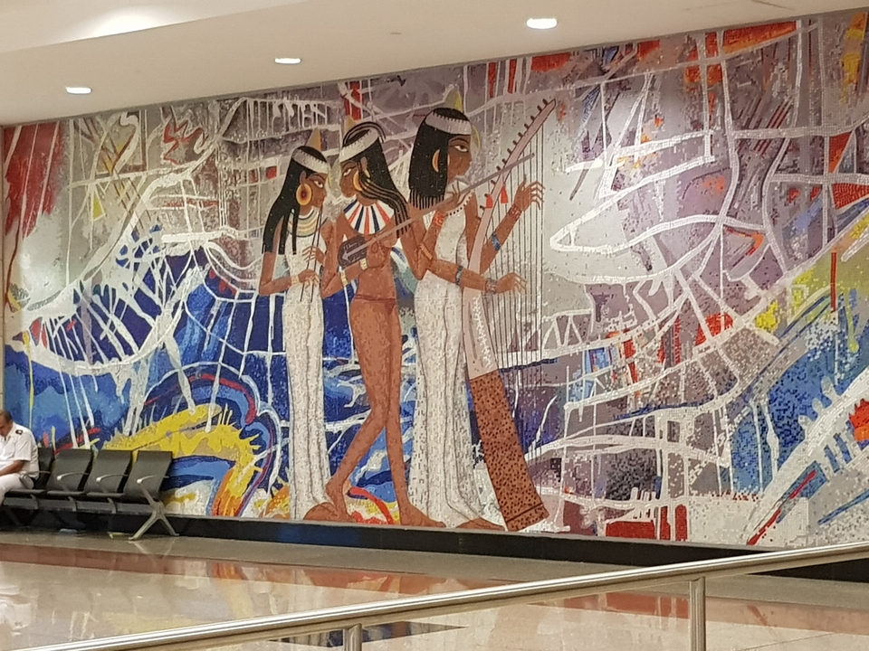 Colorful mosaic mural depicting ancient Egyptian figures.