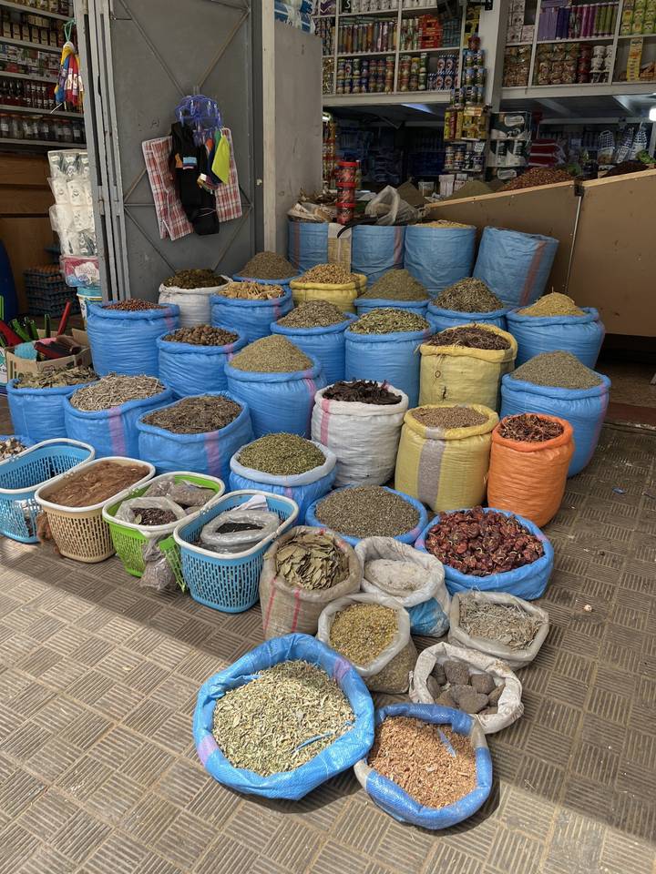 Market with various colored and textured goods.