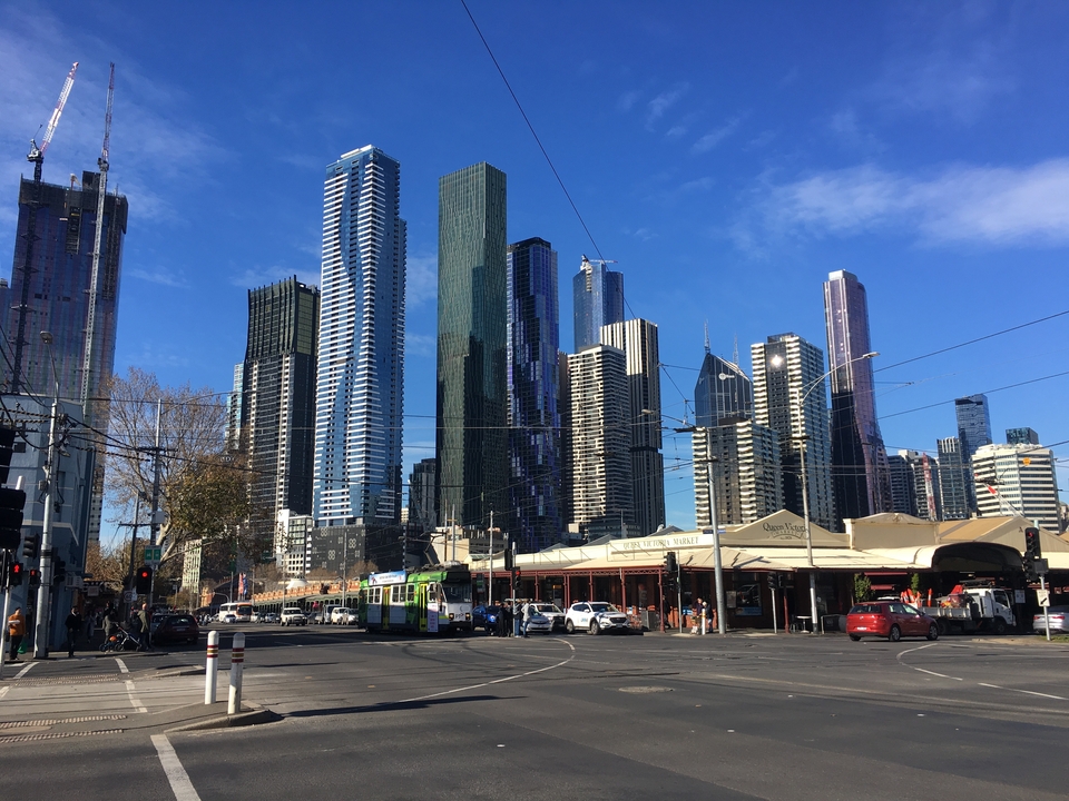 Cityscape of Melbourne with tall skyscrapers and market.