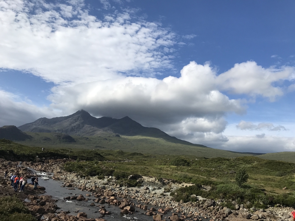 Mountainous landscape with dramatic clouds in Scotland.