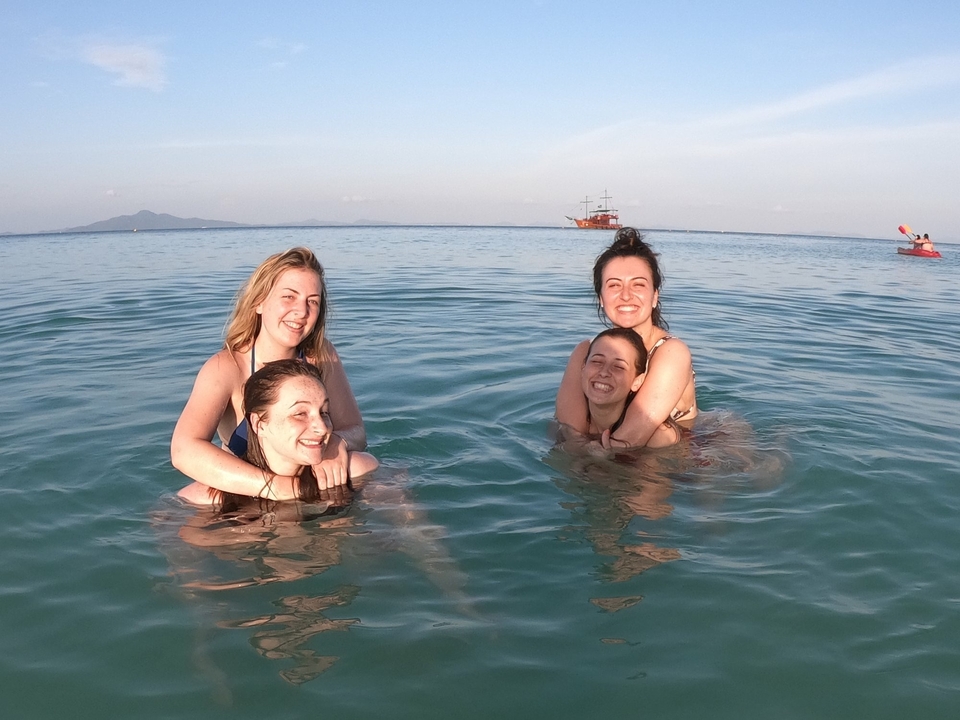 Group of four people enjoying time in the water