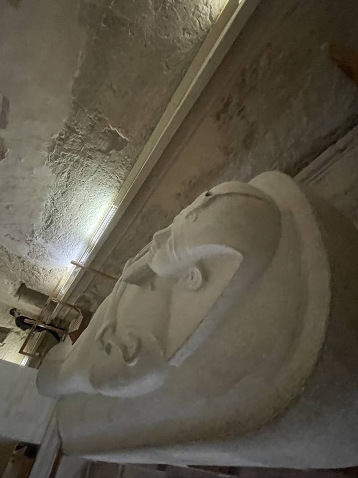 Close-up of a carved figure inside an Egyptian temple.