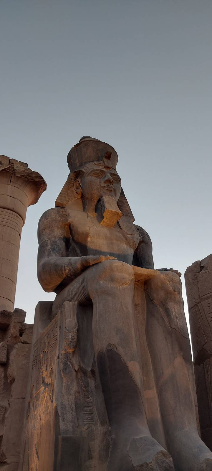 Statue from an ancient temple viewed from below.