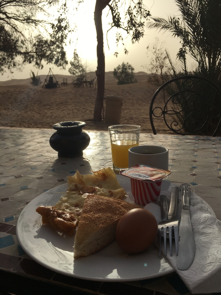 A breakfast setting with orange juice and coffee.