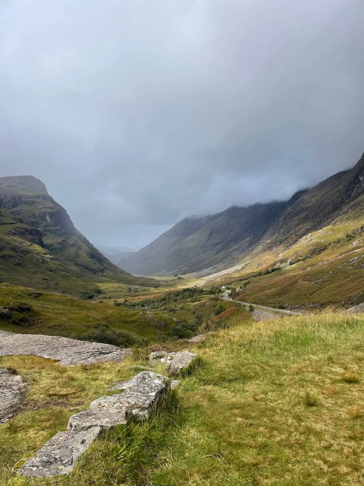 A mountainous landscape view under a misty sky.