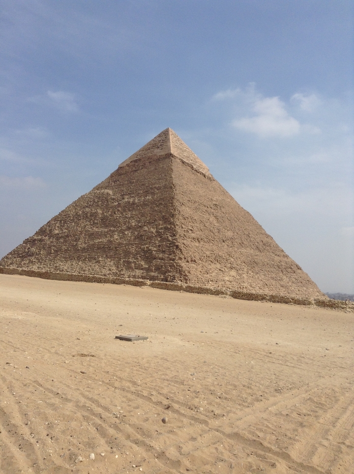 Pyramid in the desert under a clear sky