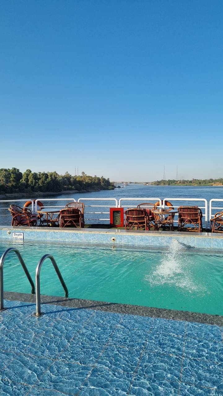 Swimming pool with loungers on a cruise ship.