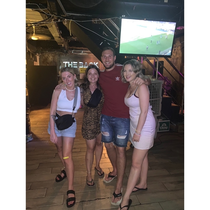Group of friends posing in a club.