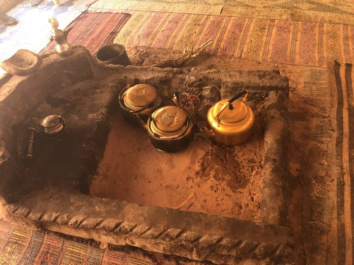 Traditional Bedouin cooking setup with tea pots.