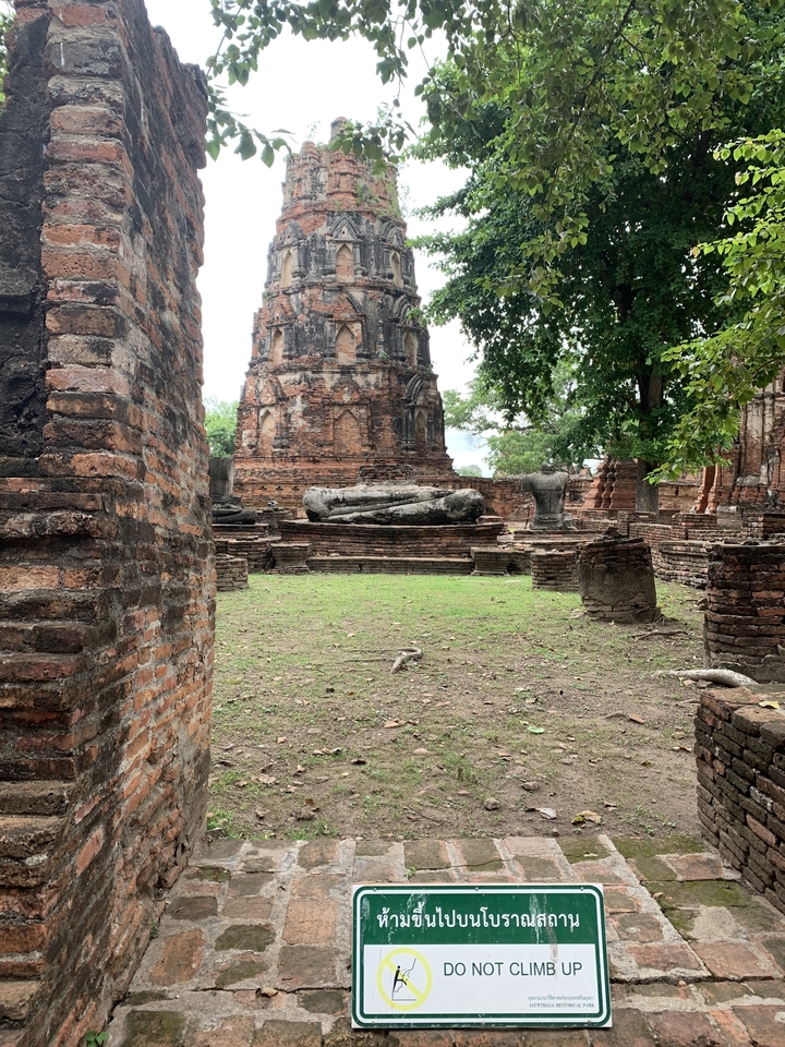 Ancient brick structures with Buddha statues.
