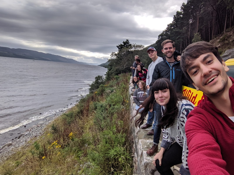 Group by a scenic water view.