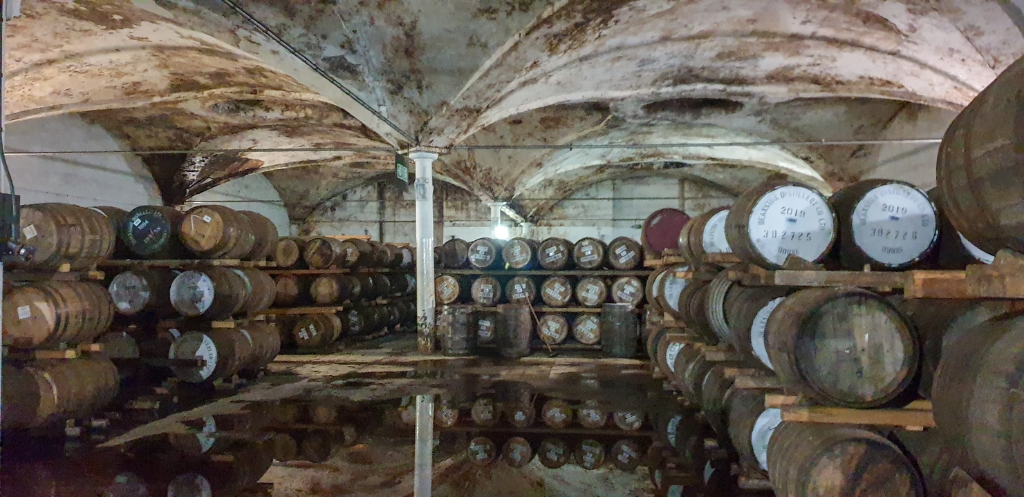 Interior of a whisky barrel storage area.
