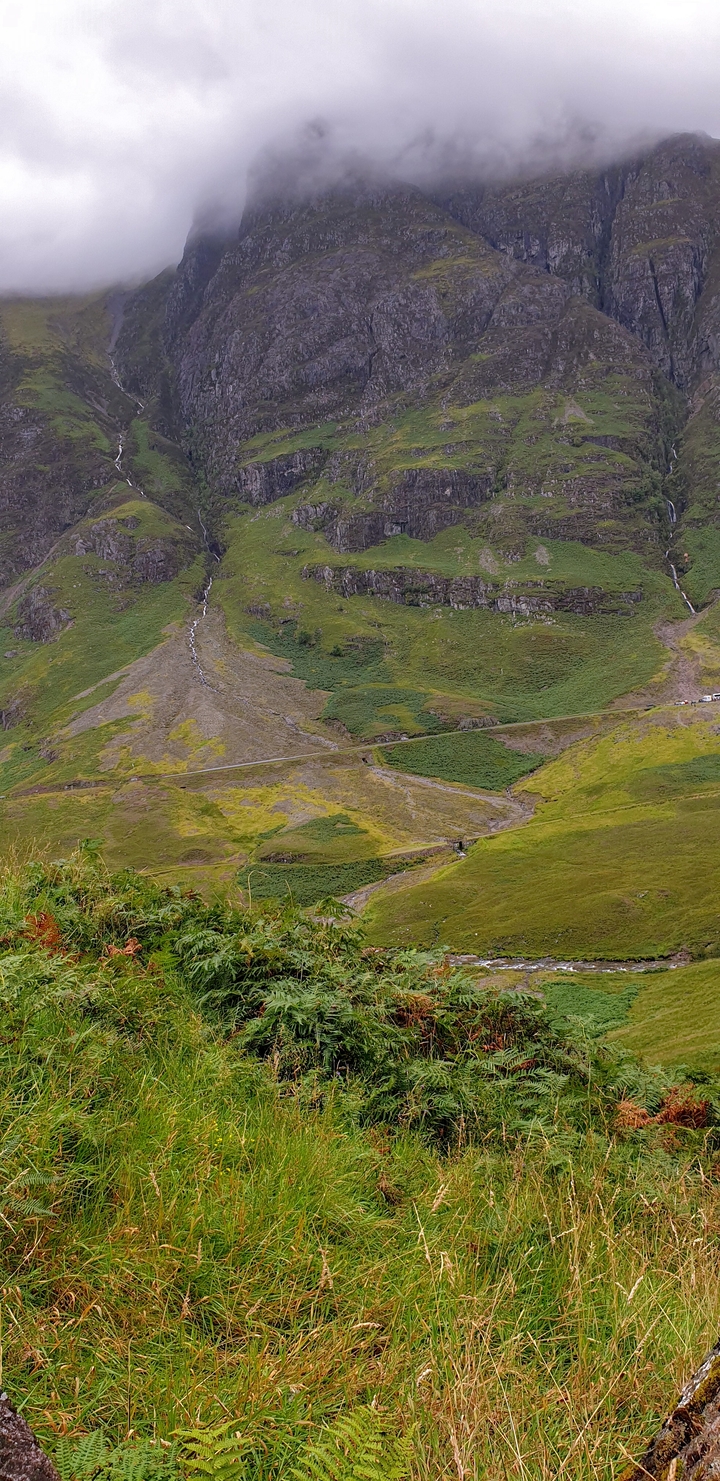 A rugged hill landscape with visible paths.