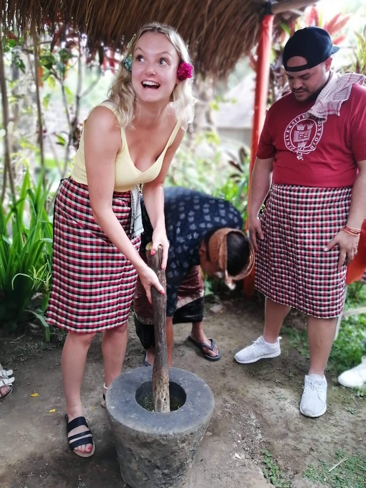 People wearing traditional clothing, engaging in a cultural activity.