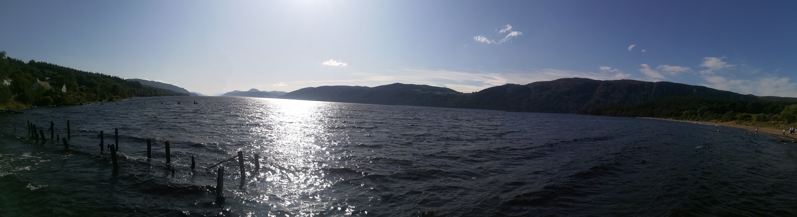 Scenic view of a large lake with hills in the background